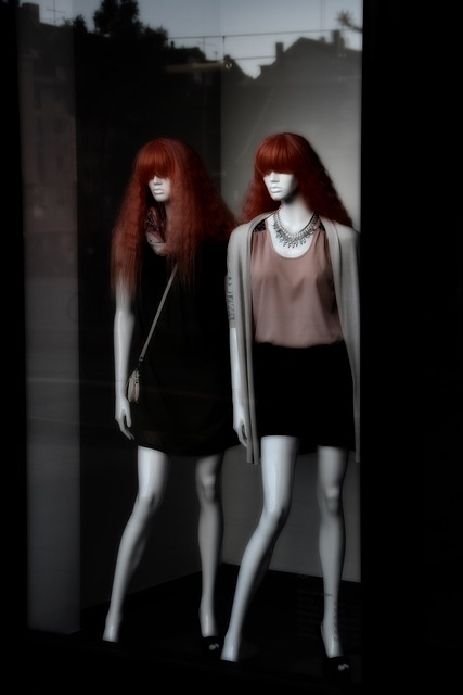A clothing display idea on mannequins with red wigs