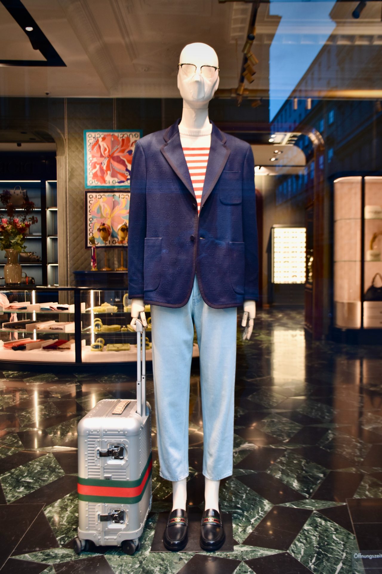 A mannequin with a suitcase display idea