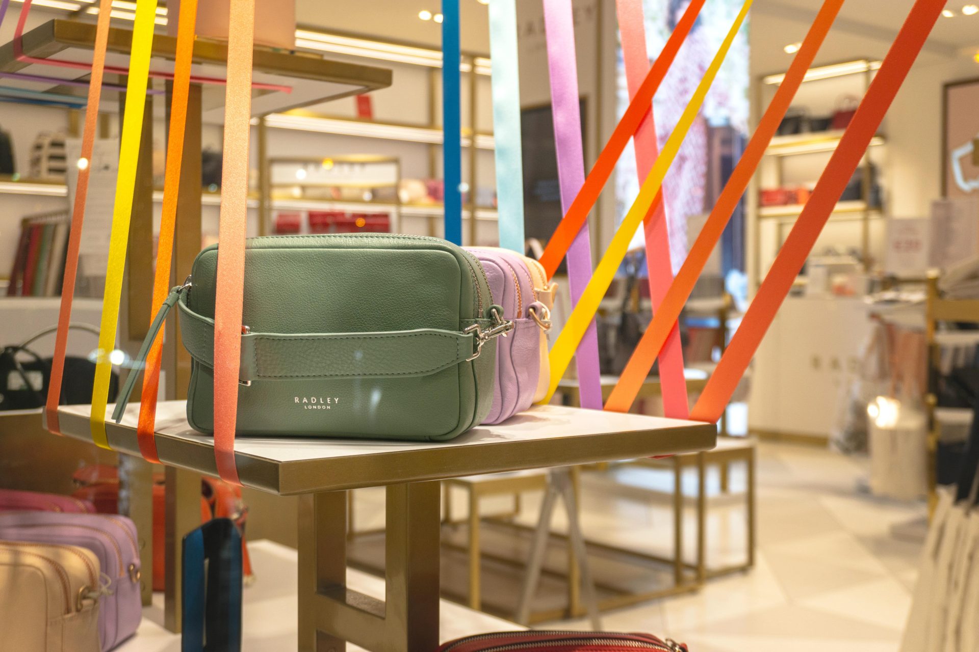 A Radley bag on display in a luxury shop