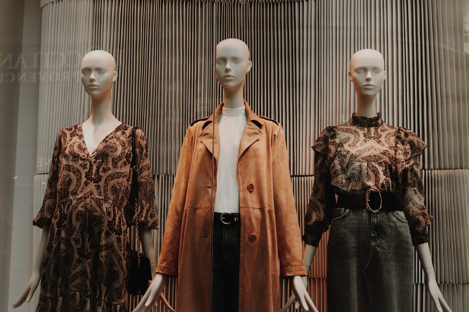 Mannequin displays as clothing racks