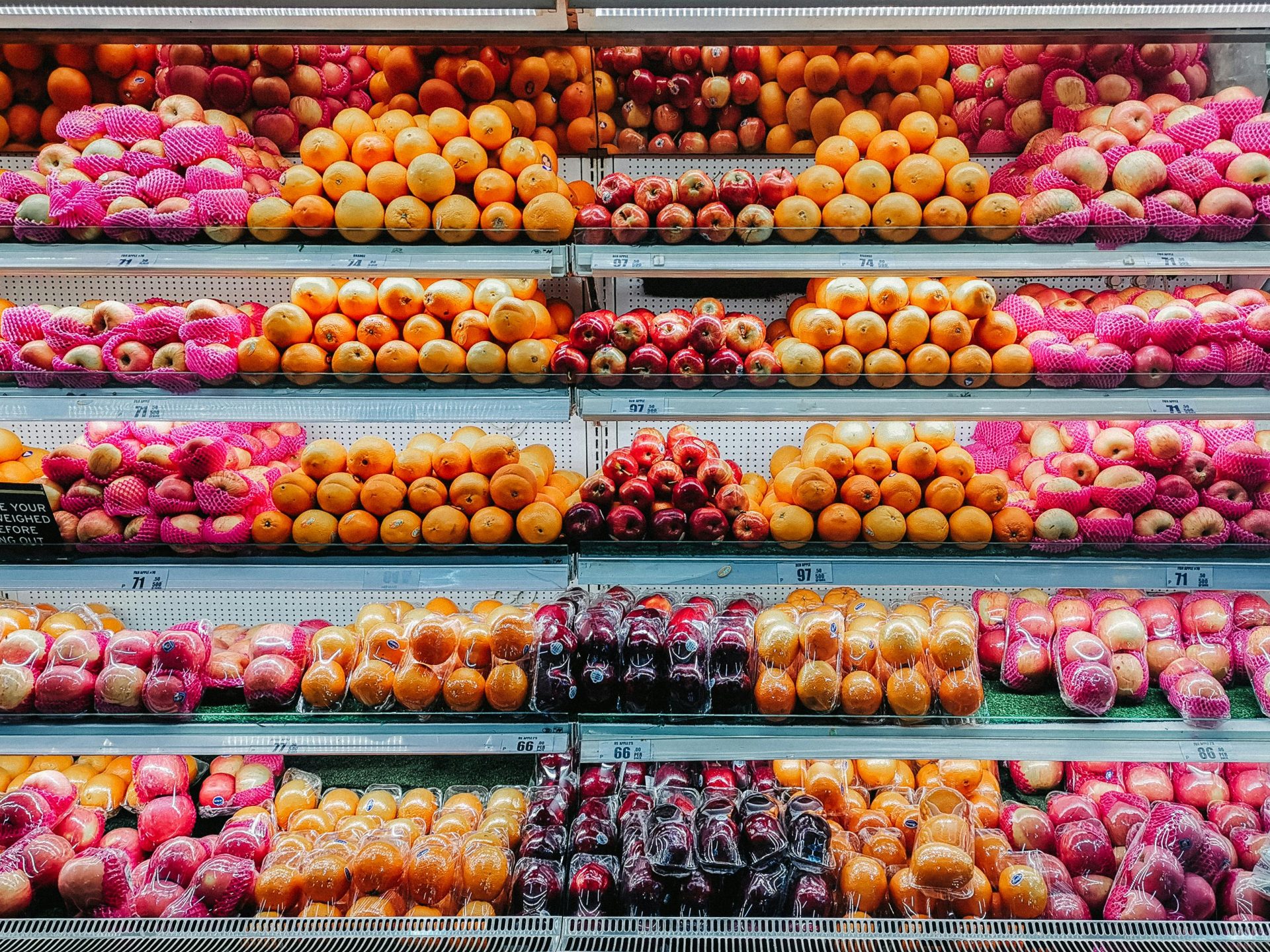 A brightly coloured fruit produce display in a supermarket
