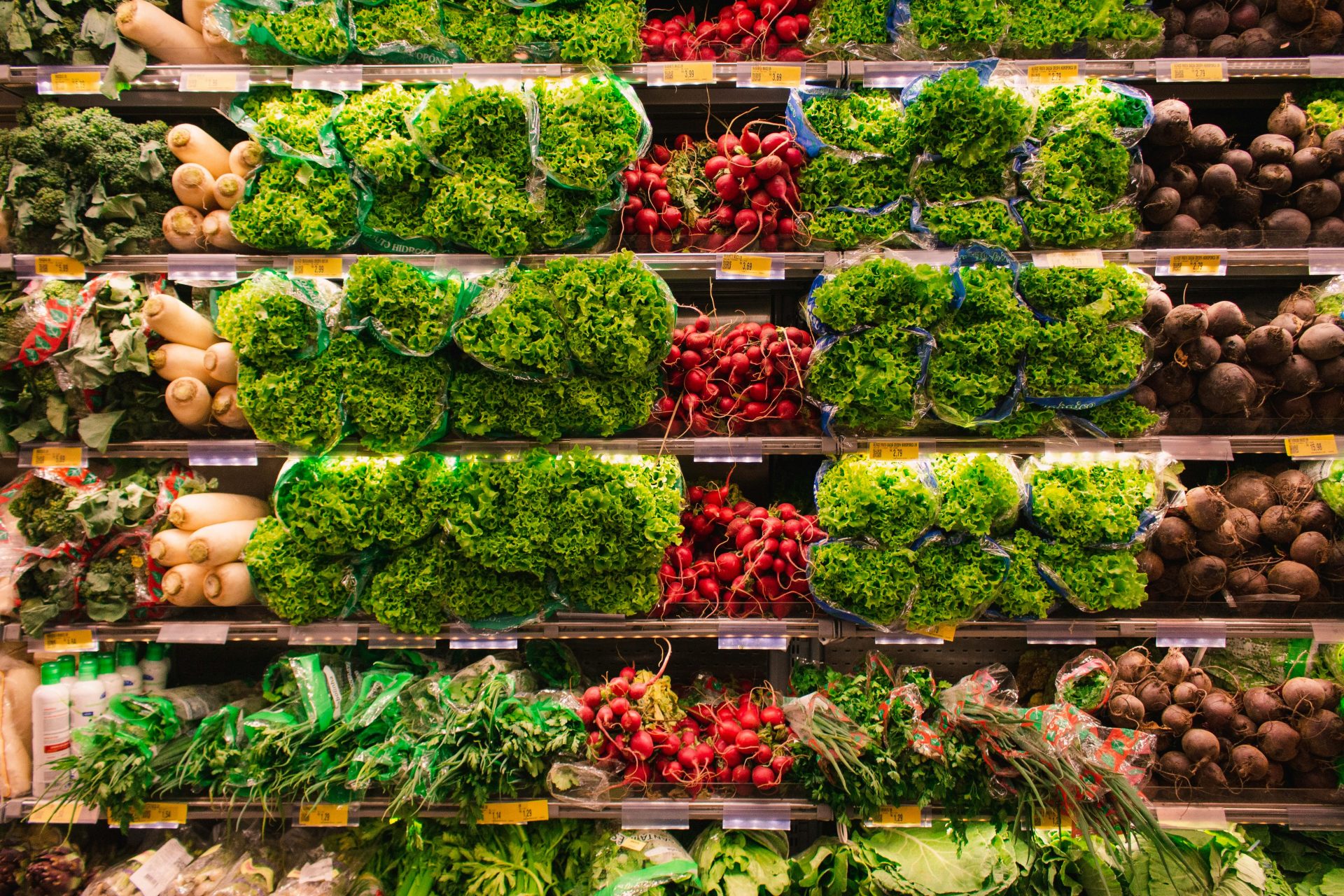Vegetable produce stacked in vertical shelving