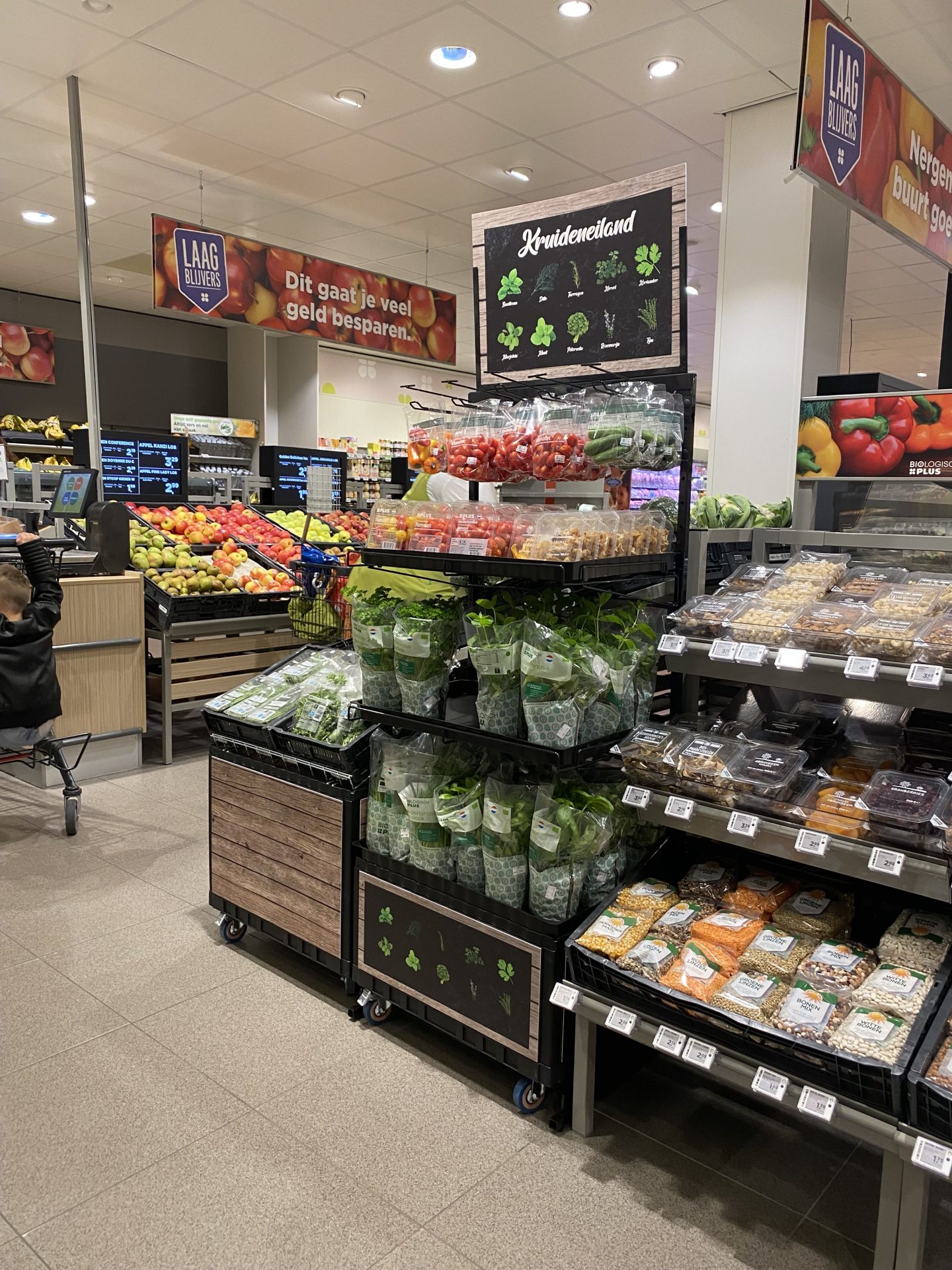 Fresh herb display in a supermarket produce section